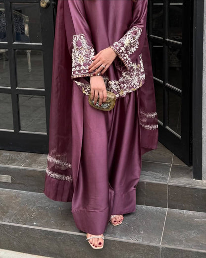 Majestic Aura: Woman in Wine Captivates at the Doorway