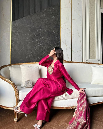 A Vision of Confidence in a Stylish Pink Suit